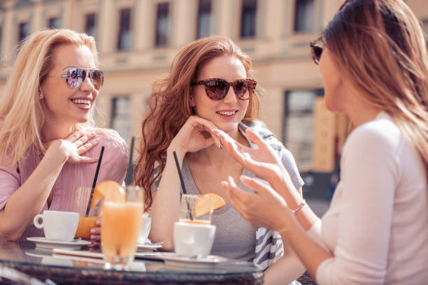 istock Female friends enjoying in cafe 962781816