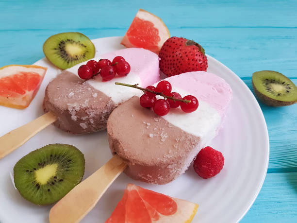 istock ice cream, fruit, berries on blue wooden 962781860