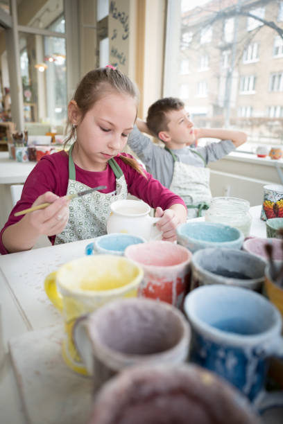 istock Painting pottery and stretching 962782298