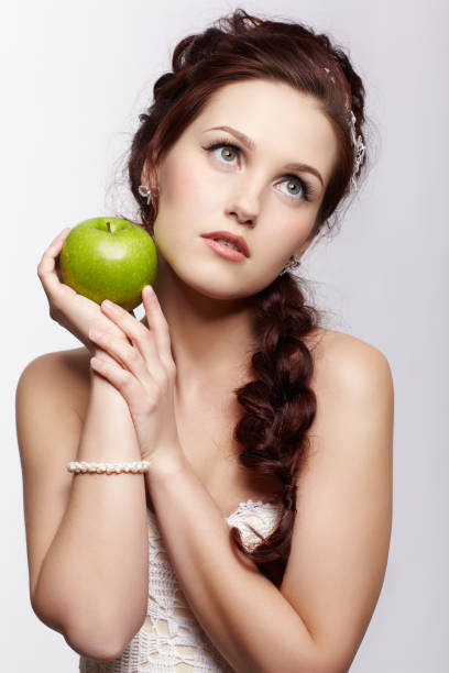 istock retro girl with apple 962783216