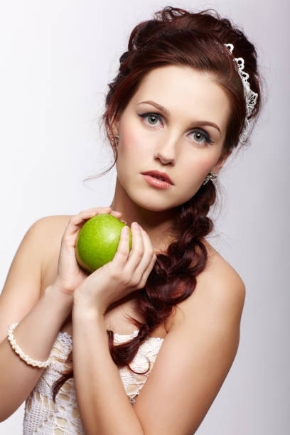istock retro girl with apple 962783218