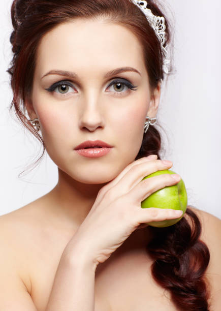istock beautiful girl with apple 962783226