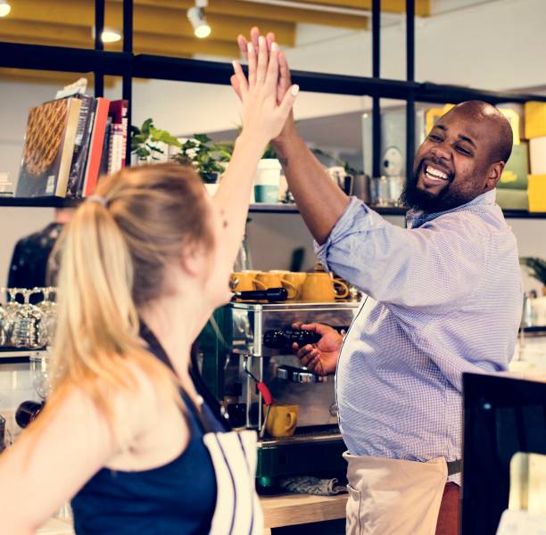 istock Colleagues give a high five to each other 962786776