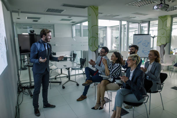 istock Businessman giving a presentation to his team 962787994
