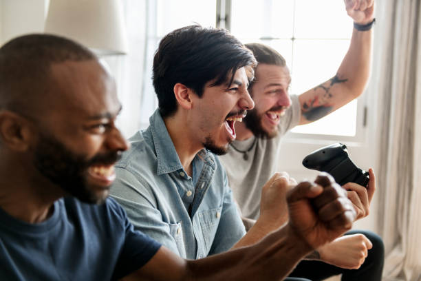 Male friends playing and enjoying with video game
