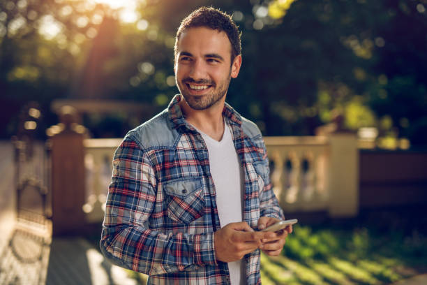 istock Man text messaging on smart phone outdoors 962789232