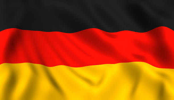 german flag waving symbol of germany - german flag imagens e fotografias de stock