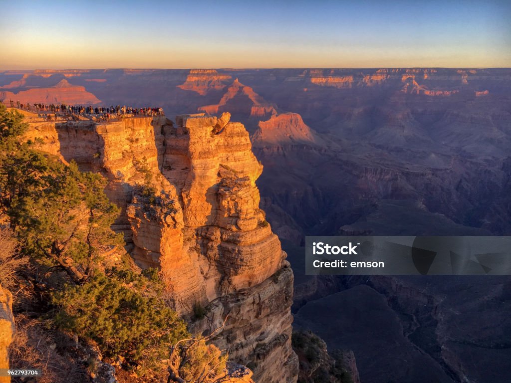 Crowed Mather Point at Grand Canyon sunrise Crowed Mather Point at Grand Canyon south rim with a lot of people watching sunrise on a sunny moring in fall Arizona Stock Photo