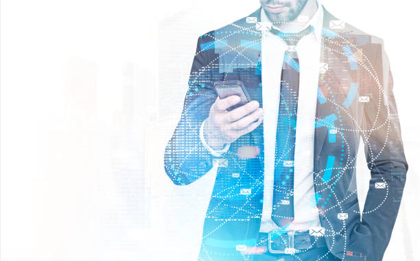 istock Businessman looking at phone, email in city 962793994
