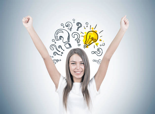 istock Happy young woman with hands in the air, answer 962794400