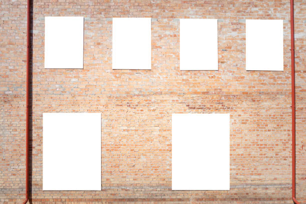 istock Mock up. Blank vertical billboards, poster frames, advertising on brick wall. 962795568