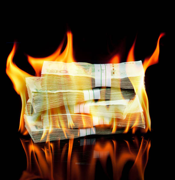 istock Thai money bill on fire with black background 962798704