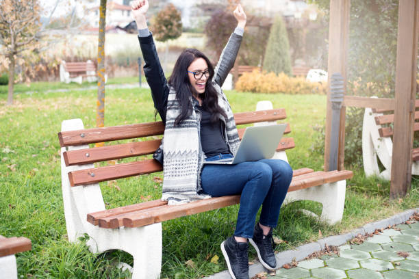 istock Happy woman with laptop 962800726