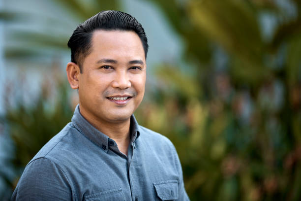 istock Portrait of confident man smiling in yard 962800762