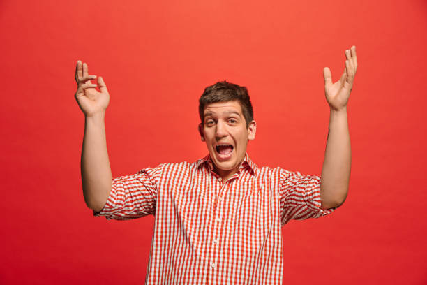istock Winning success man happy ecstatic celebrating being a winner. Dynamic energetic image of male model 962805256