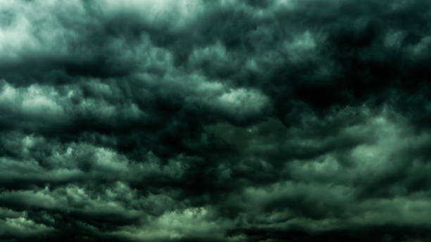 istock Dramatic dark sky and clouds. Cloudy sky background. Black sky before thunder storm and rain. Background for death,  sad, grieving or depression. 962805670