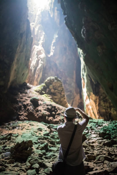 istock Man looking at light inside of the Batu caves 962810026