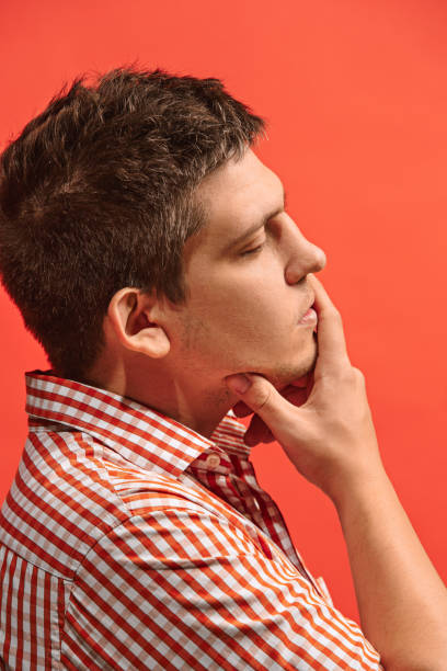 istock Young serious thoughtful businessman. Doubt concept 962816344