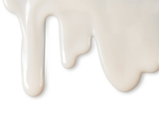 istock Dripping white milk, cream, paint yogurt on white background 962816684