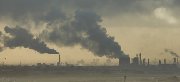 Industrial air pollution - factories near Middlesbrough releasing smoke in the environment Factories in Middlesbrough's industrial area. middlesbrough stock pictures, royalty-free photos & images