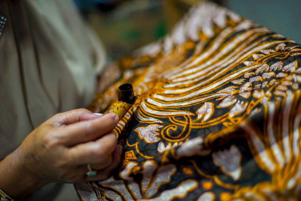 Painting Batik Close Up Hand Painting Batik on the Fabric. Batik Tulis in Solo Indonesia batik indonesia stock pictures, royalty-free photos & images