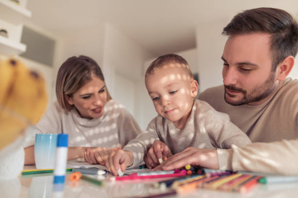 istock Happy young family at home 962831536