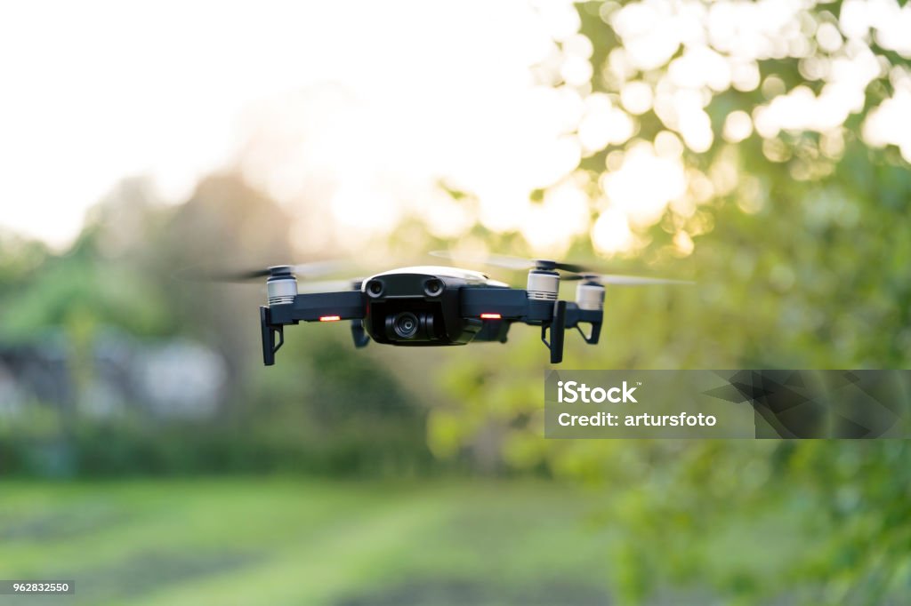 Flying quadrocopter, remote controlled drone with camera Drone Stock Photo