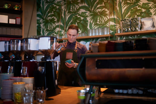 istock Barista in coffee shop 962833074