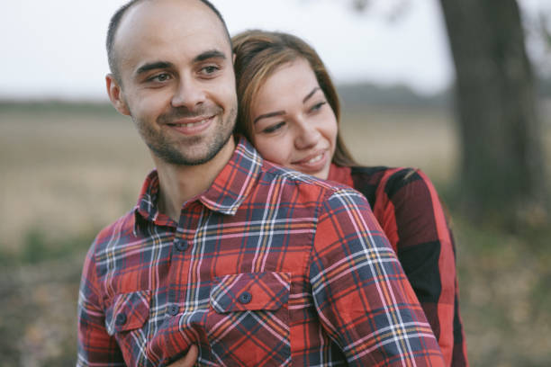 istock couple in a field 962849126