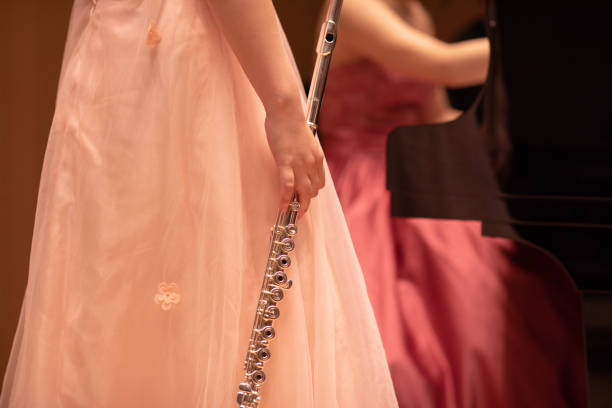 Flautist and pianist discussing in rehearsal
