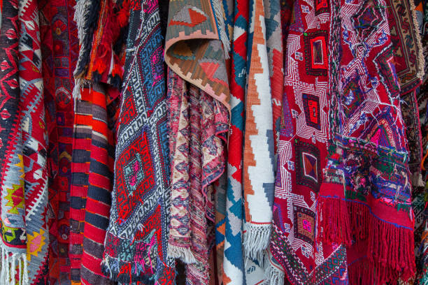 istock Oriental carpets in street market 962858896