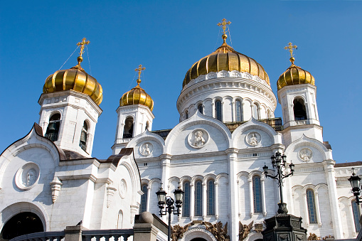 Blue domes of Holy bogolyubovsky monastery against cloudy sky