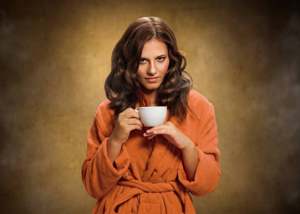 istock Young woman with tea cup 962877626