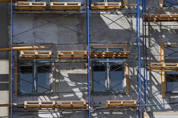 istock Fragment of a building facade with scaffolding 962881632