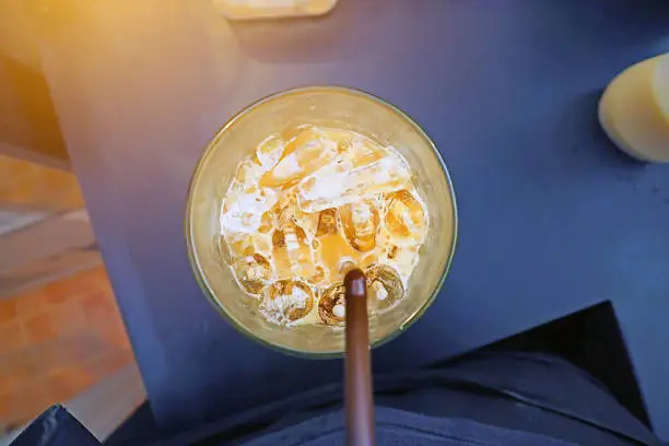 sucking iced milk coffee to refresh your life