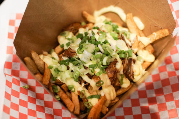 istock french fries with green onions and pull pork 962884650