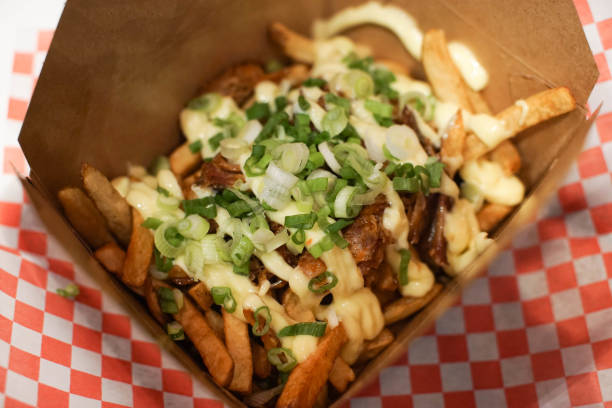 istock french fries with pulled pork and onions in a take out box 962884654