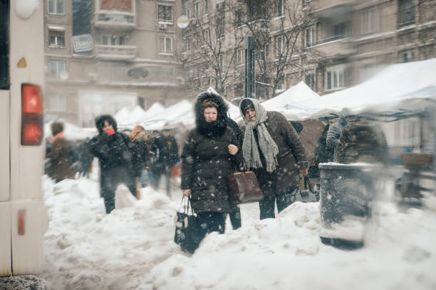 istock People On Snow Covered Street During Winter 962887386