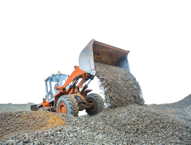 istock tractor poring gravel isolated white 962887722