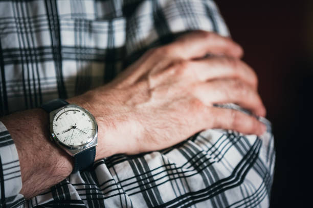 istock Midsection Of Man Wearing Wristwatch 962892632