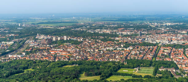 Aerial view of the southern edge of the city of Braunschweig, with parts of the railway station, residential buildings with detached houses, terraced houses and high-rise buildings. Aerial view of the southern edge of the city of Braunschweig, with parts of the railway station, residential buildings with detached houses, terraced houses and high-rise buildings, airplane braunschweig stock pictures, royalty-free photos & images