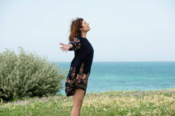 istock Woman runs happy in a meadow 962903356