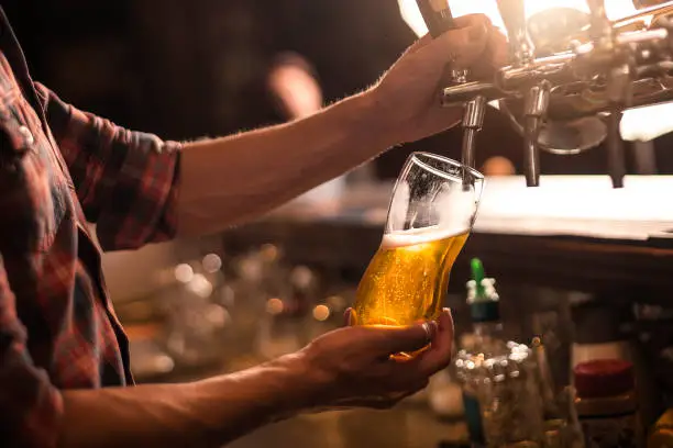 Bartender pureeing beer from a tap