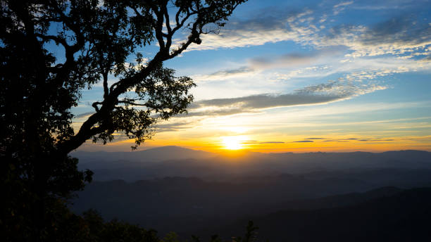 istock Panoramic scenery of mountains at sunset 962904582