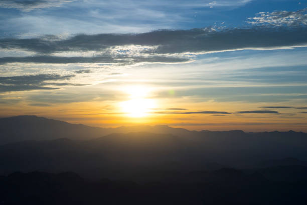 istock Panoramic scenery of mountains at sunset 962904586