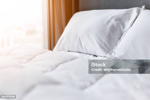 Bed Maidup With Clean White Pillows And Bed Sheets In Beauty Room Closeup Lens Flair In Sunlight Stock Photo - Download Image Now