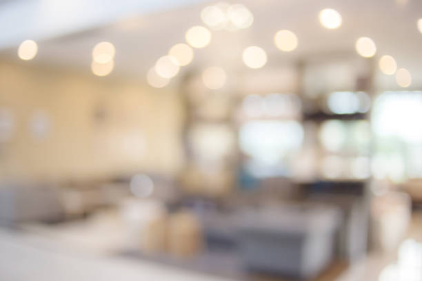 istock blur image background of shopping mall 962911562