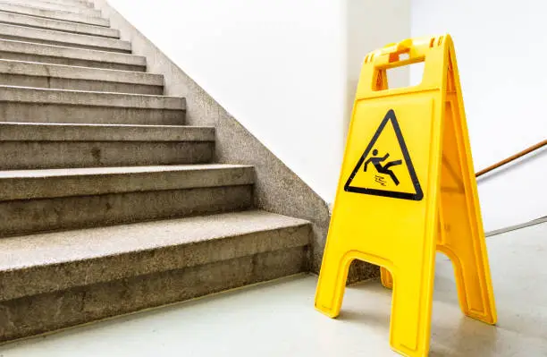 caution wet floor sign at a stairway