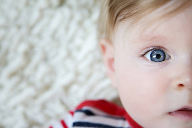 istock Adorable baby with blue eyes, natural light portrait 962921098