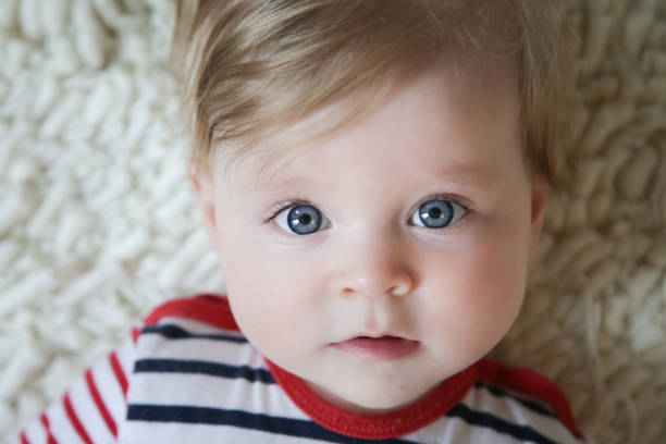 istock Adorable baby with blue eyes, natural light portrait 962921168